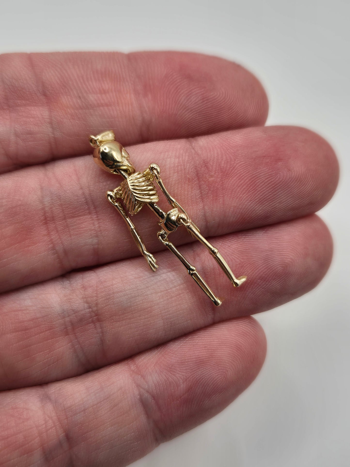 9ct gold skeleton pendant