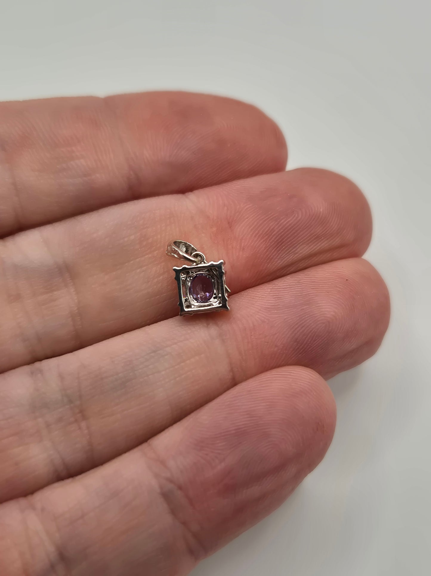 9ct white gold tanzanite and diamond pendant
