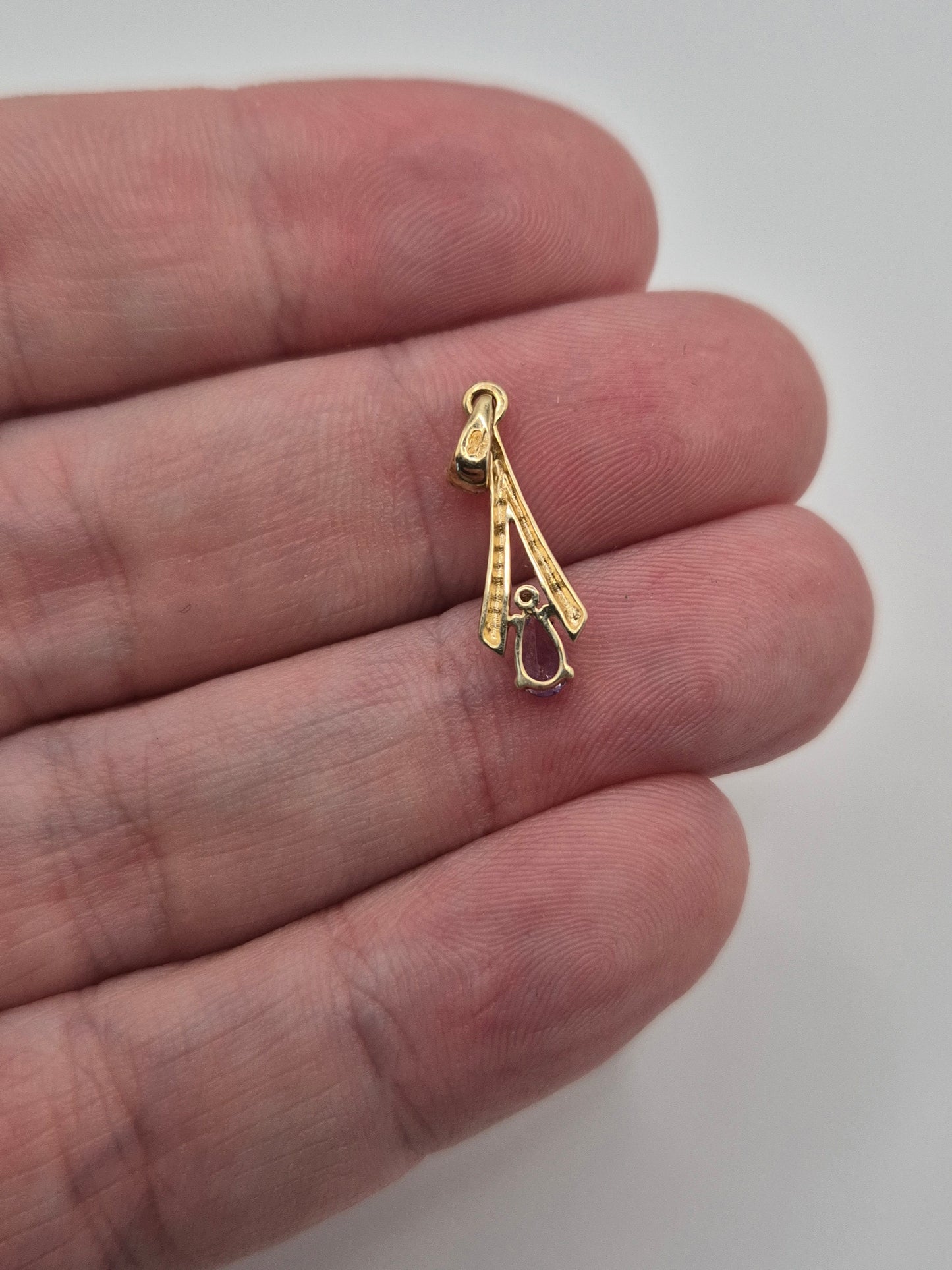 9ct gold tanzanite and diamond pendant