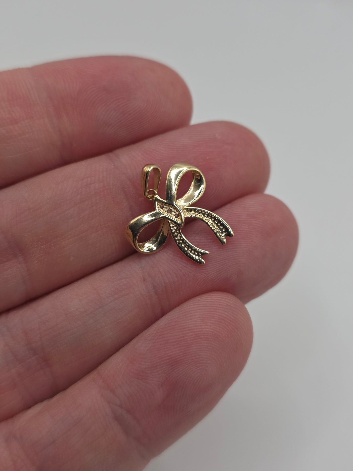 9ct gold cz bow pendant
