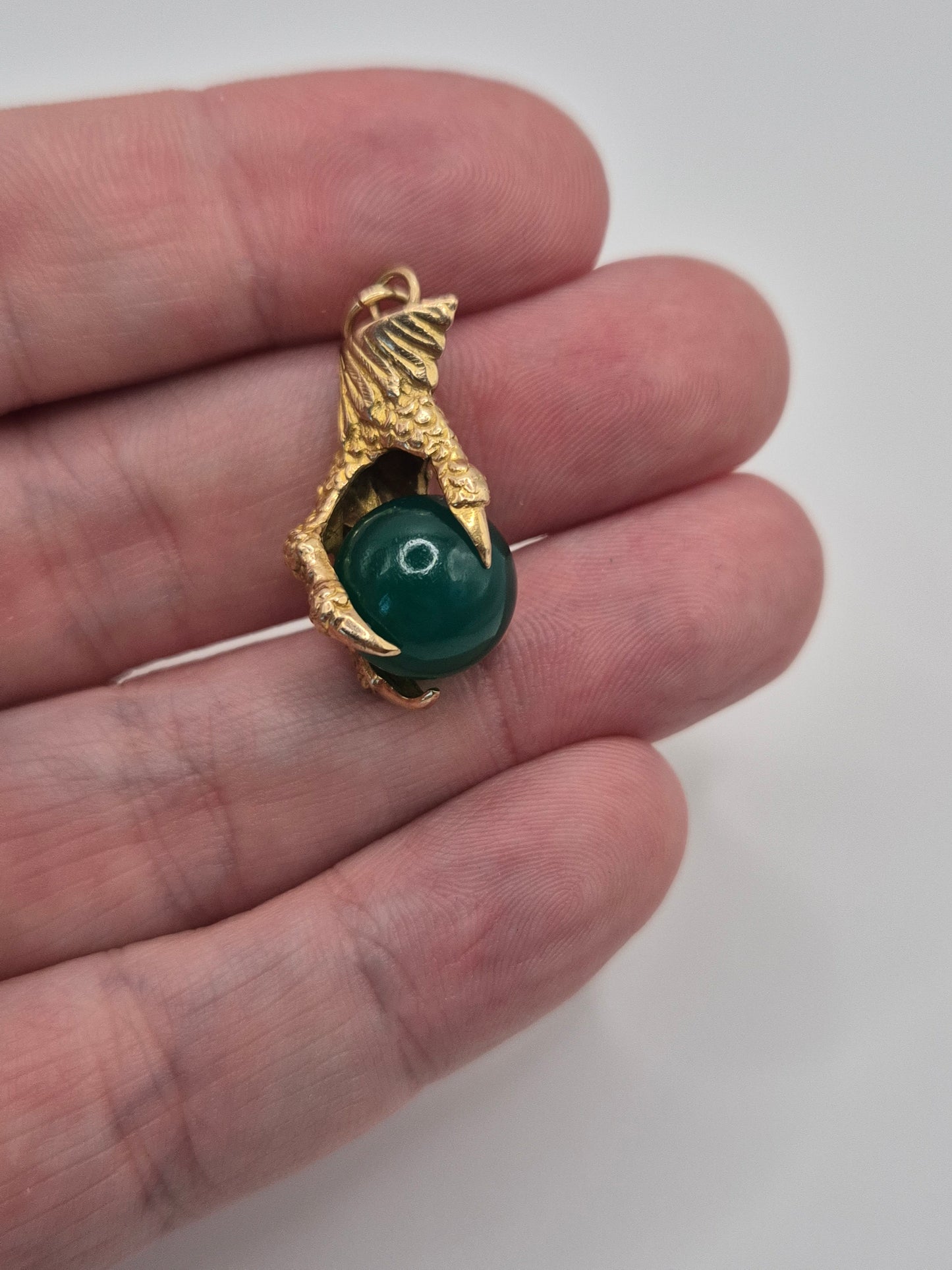 Huge 9ct gold eagle claw pendant