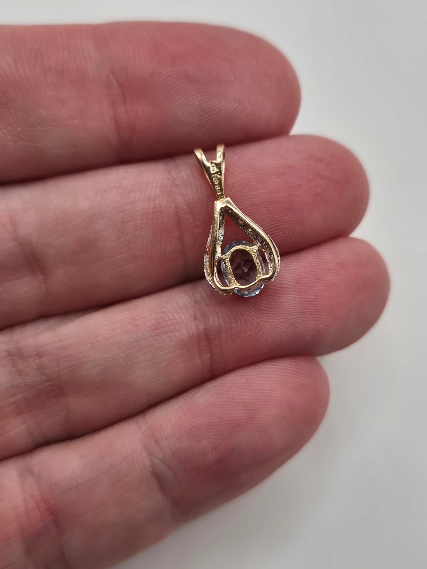 9ct gold topaz and diamond pendant