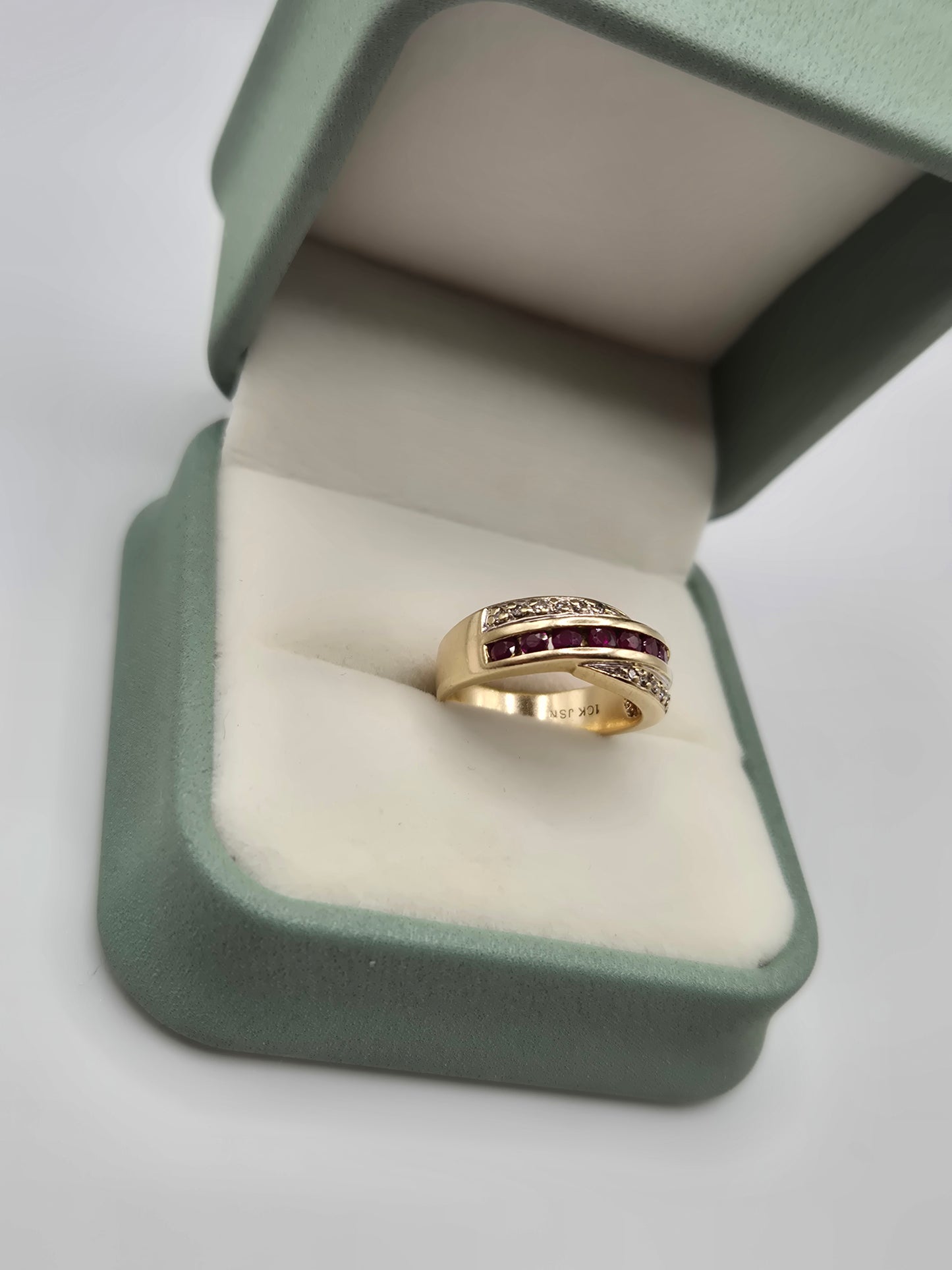 Heavy 9ct gold ruby and diamond cross over ring