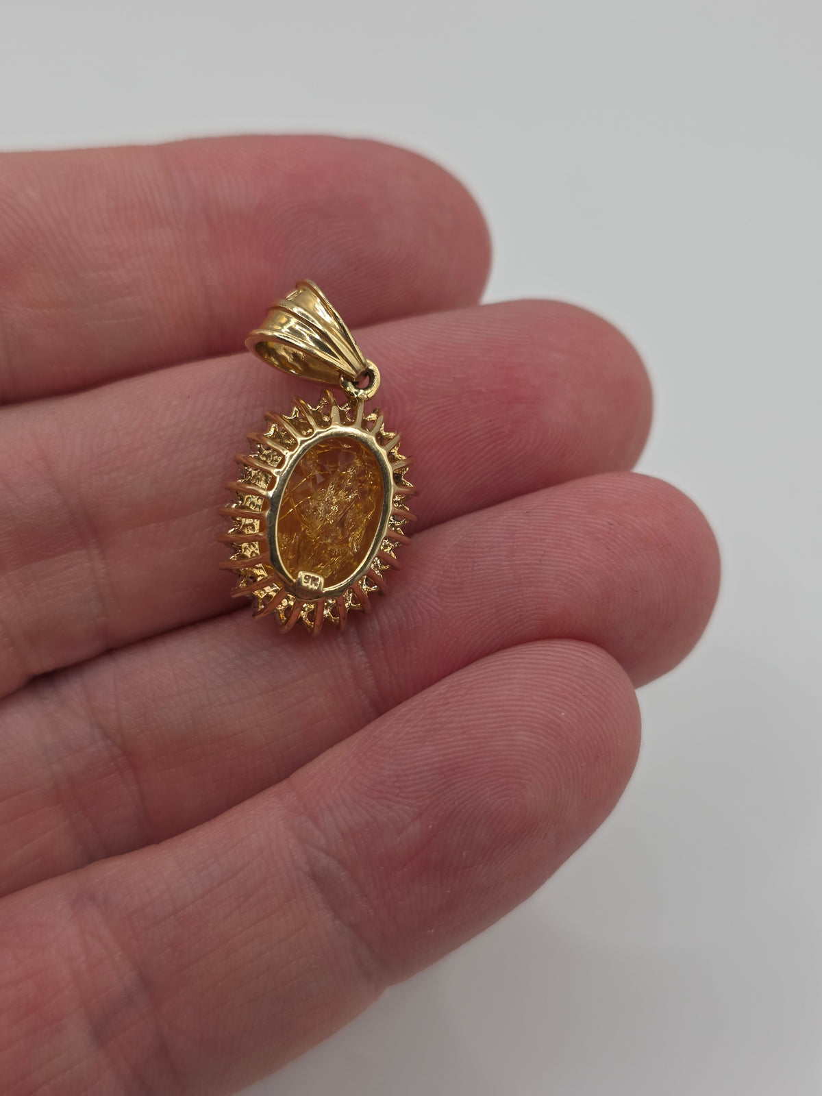 9ct gold rutile quartz and white topaz pendant