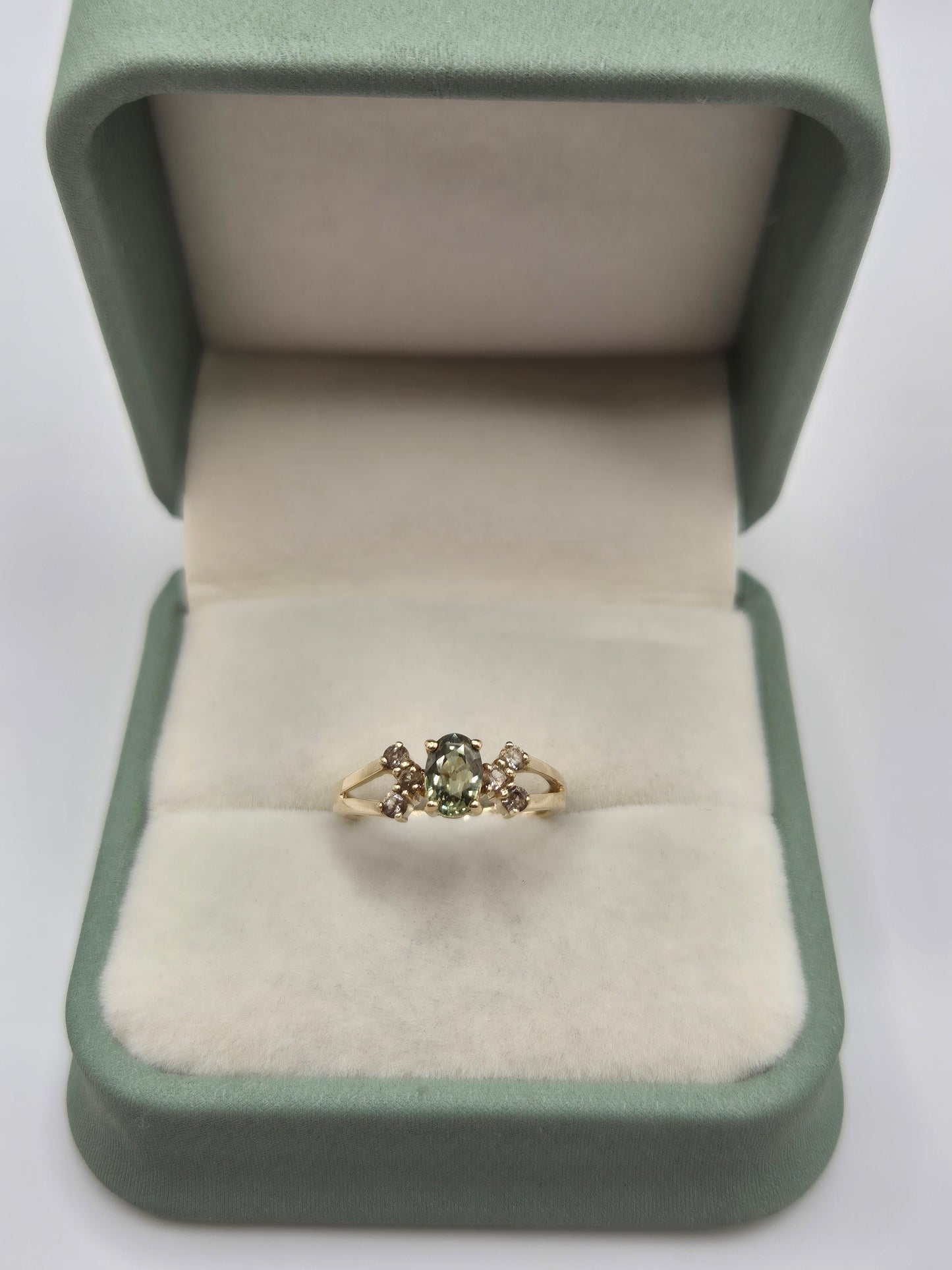 9ct gold green sapphire and white zircon ring
