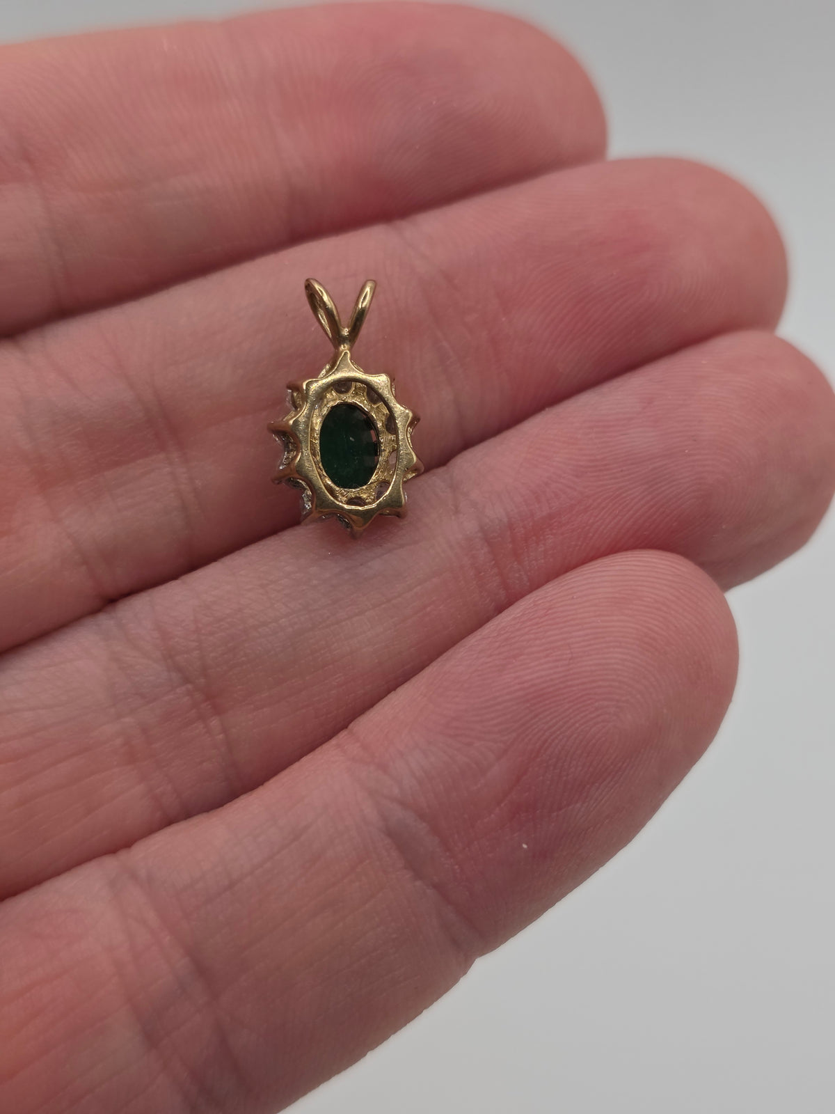 9ct gold emerald and cz pendant