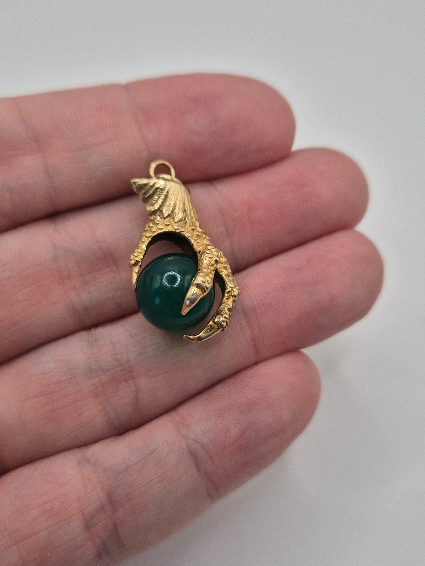 Huge 9ct gold eagle claw pendant