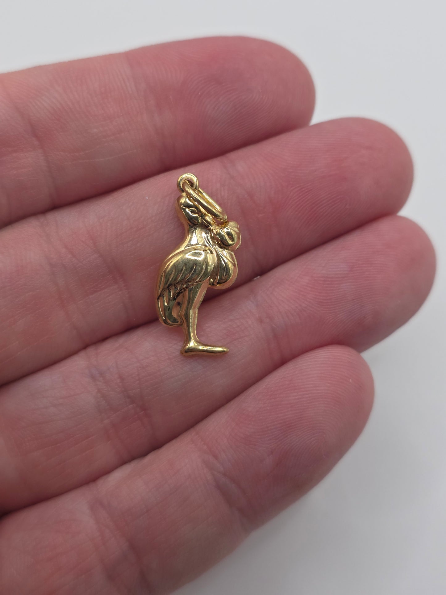 9ct gold stork and baby pendant