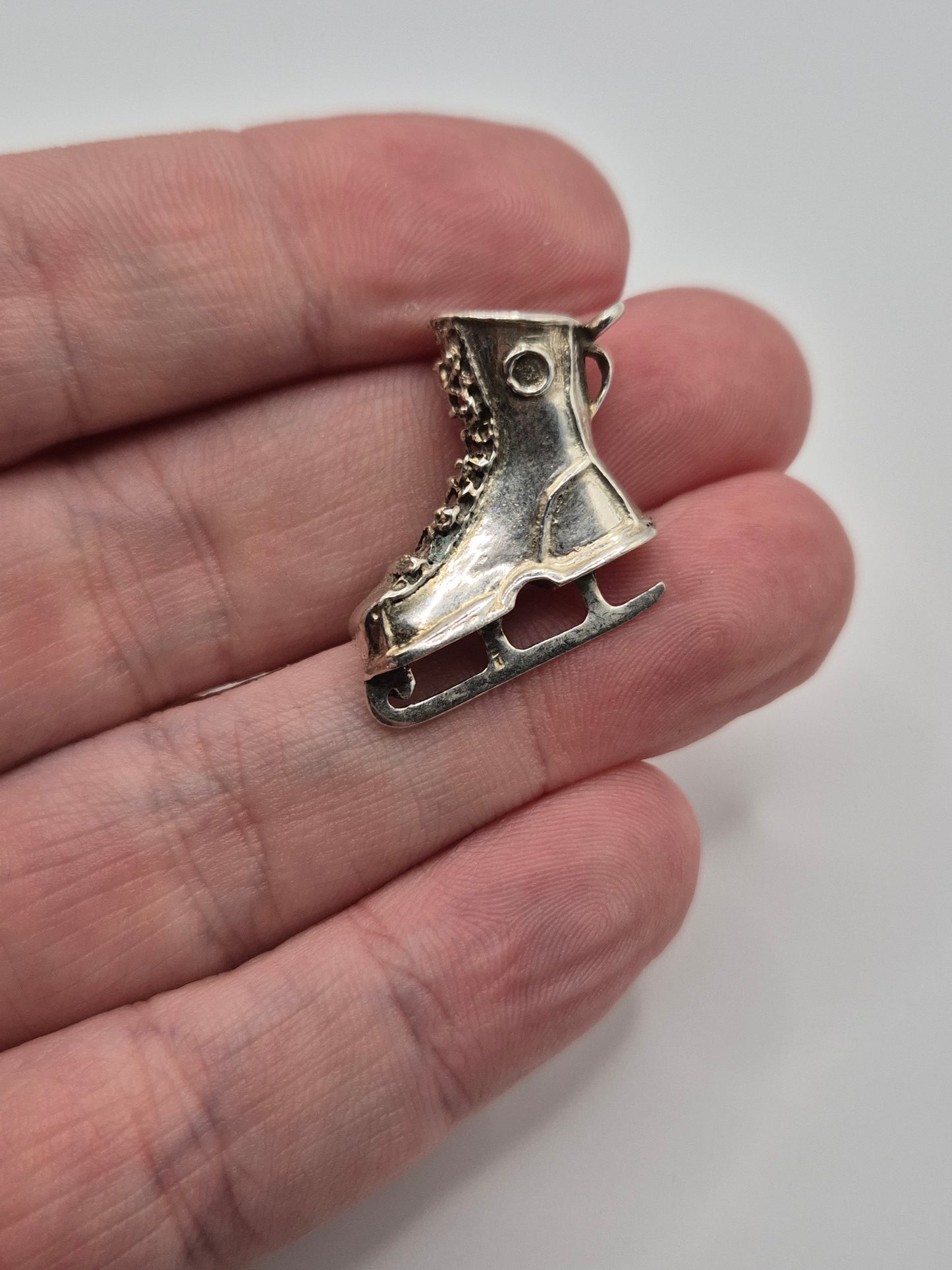 Silver ice skate charm