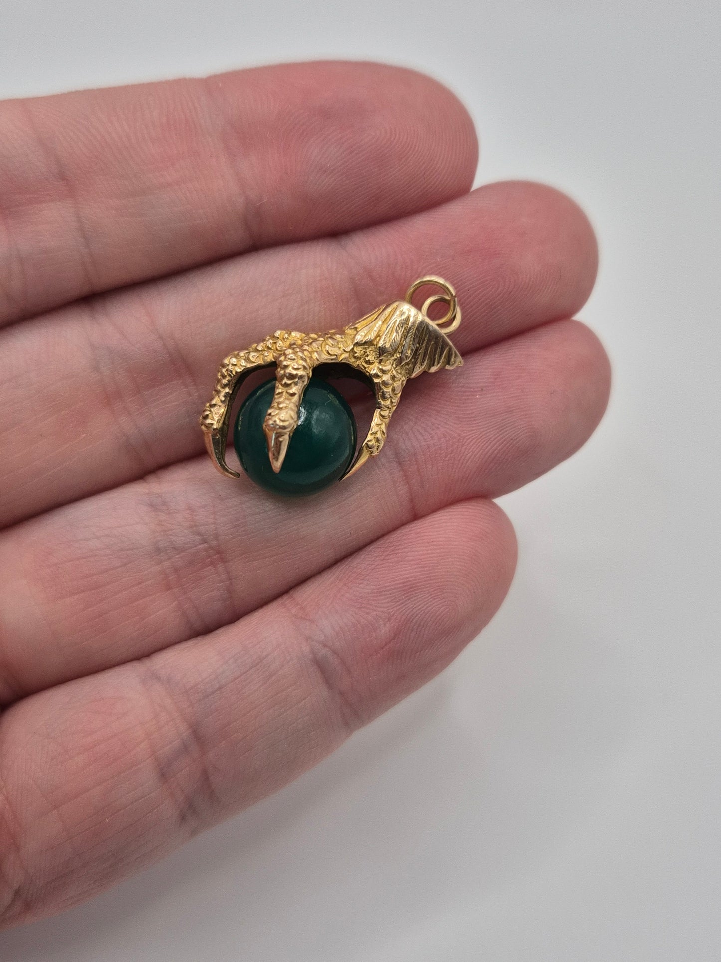 Huge 9ct gold eagle claw pendant