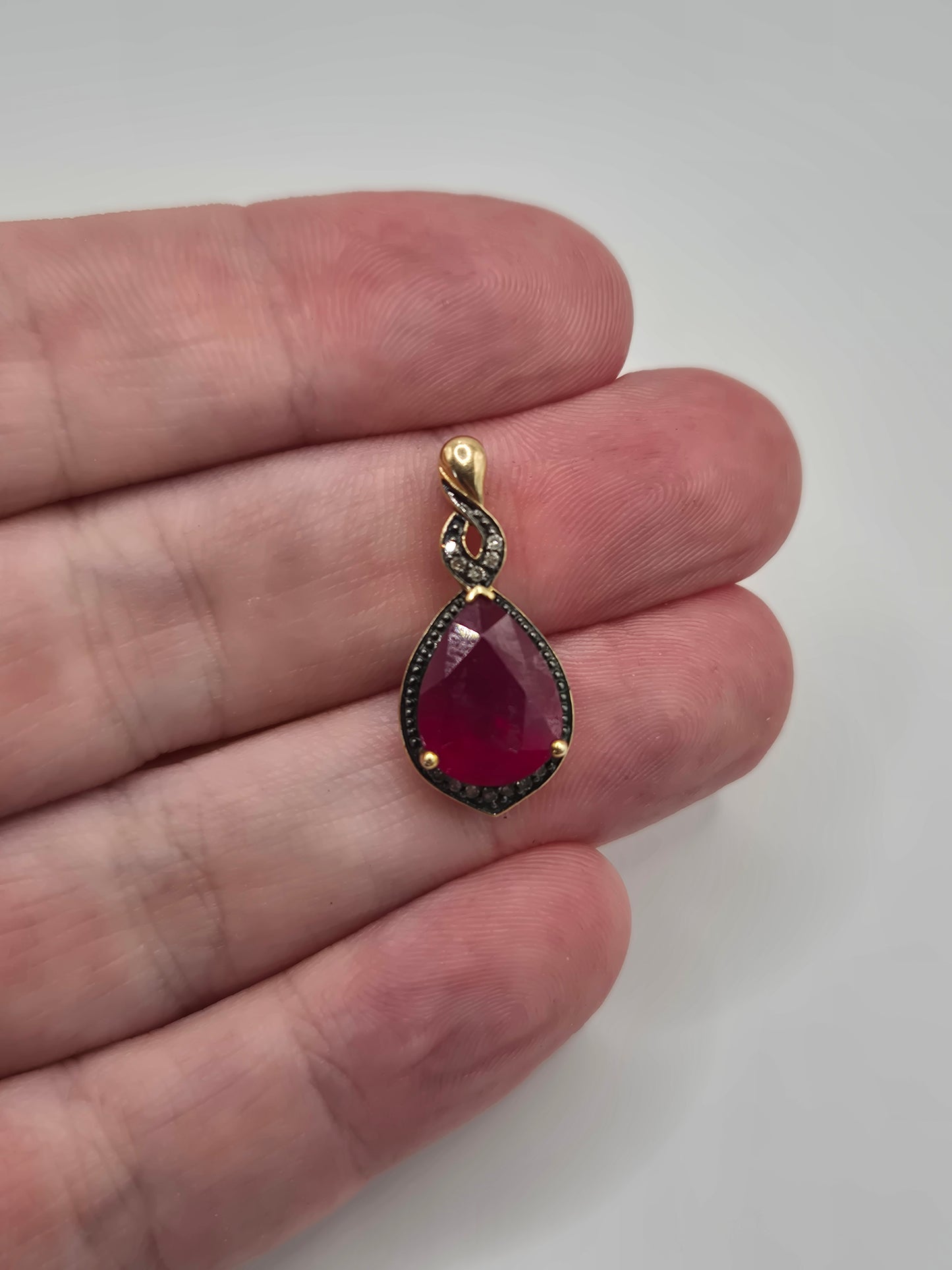 9ct gold ruby and diamond pendant