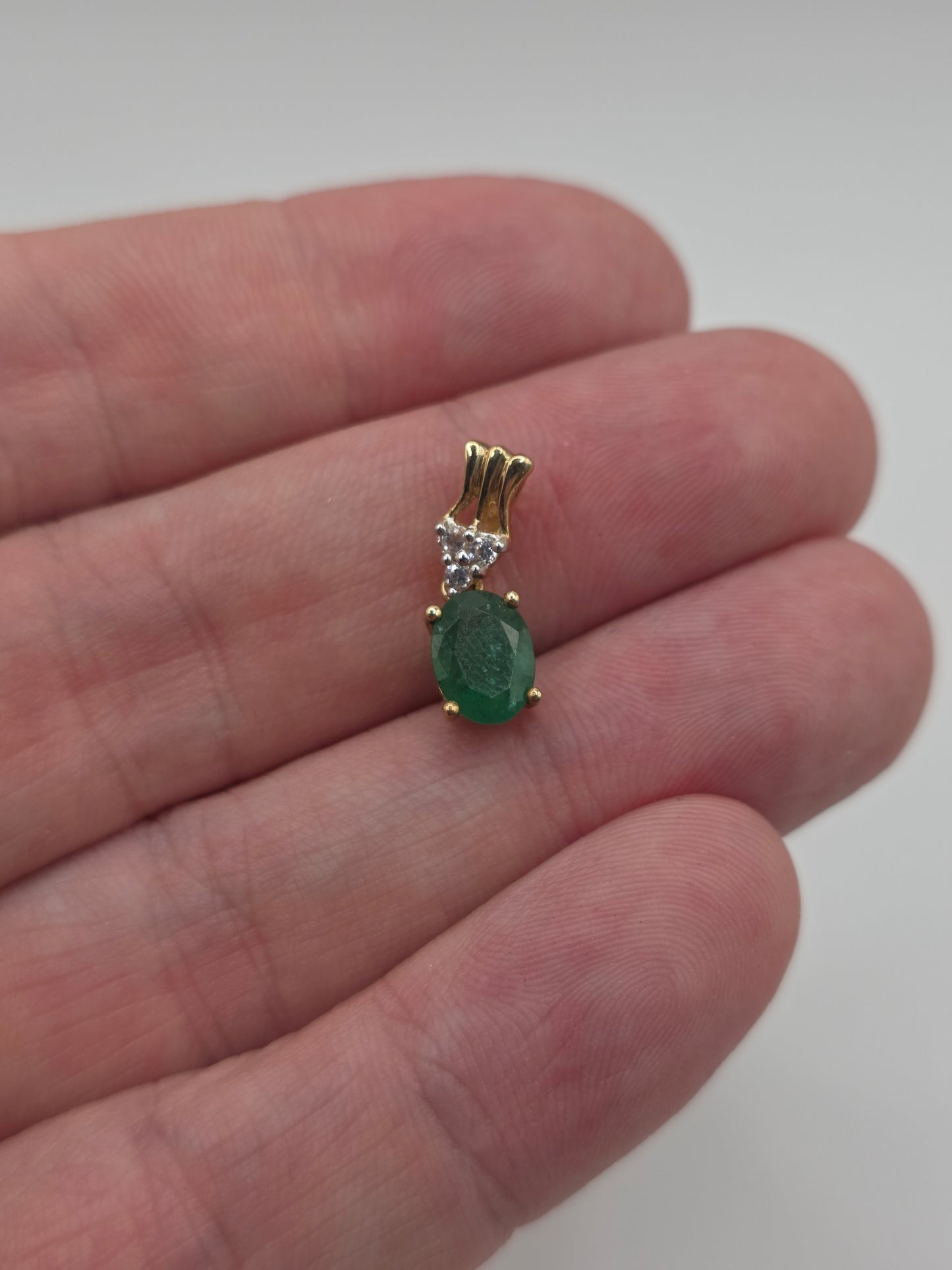 9ct gold emerald and zircon pendant