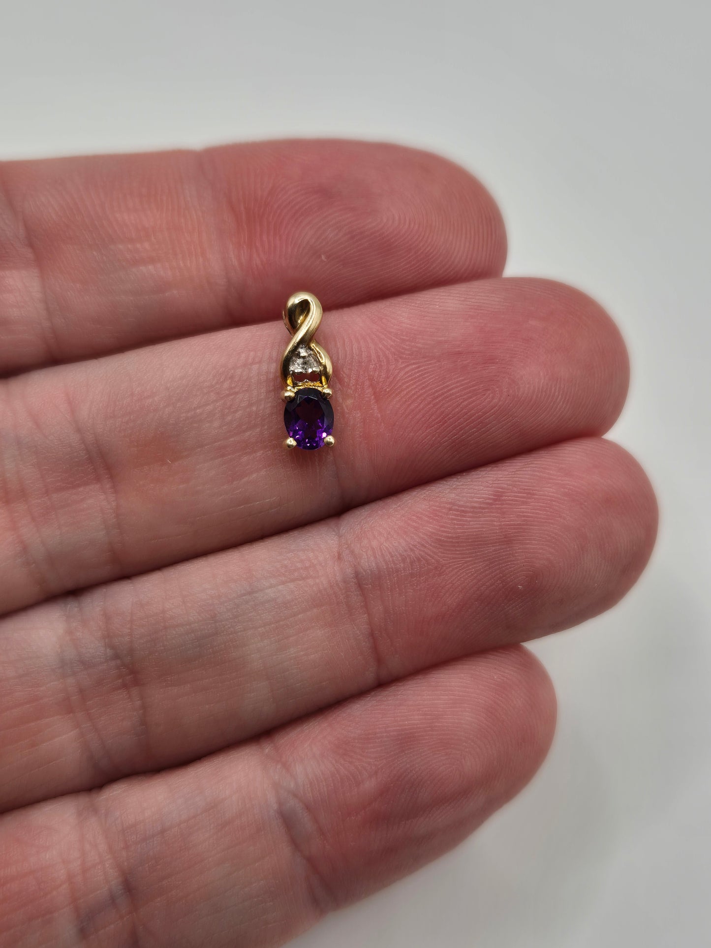 9ct gold amethyst and diamond pendant