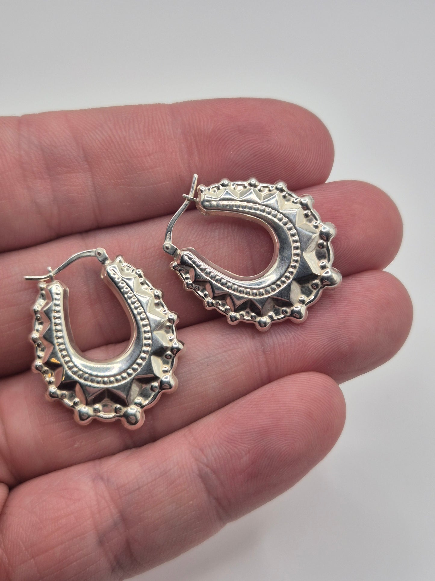 Silver creole spike earrings