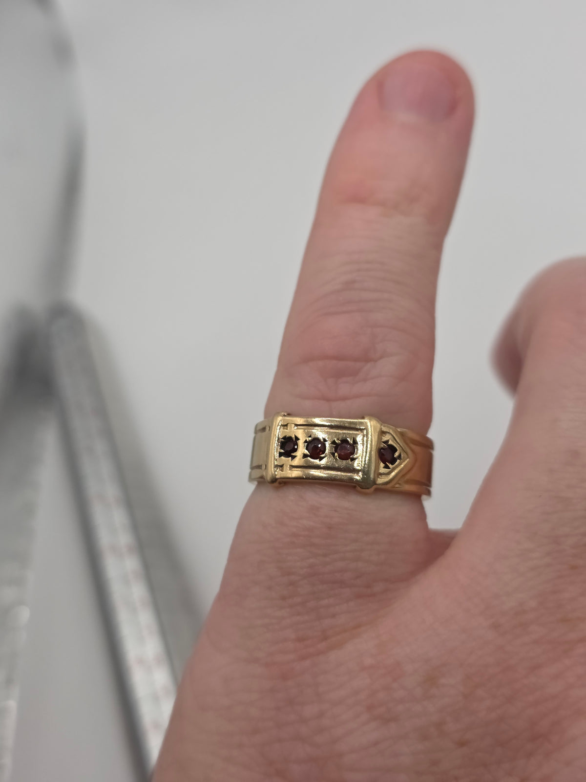 Heavy 9ct gold garnet buckle ring
