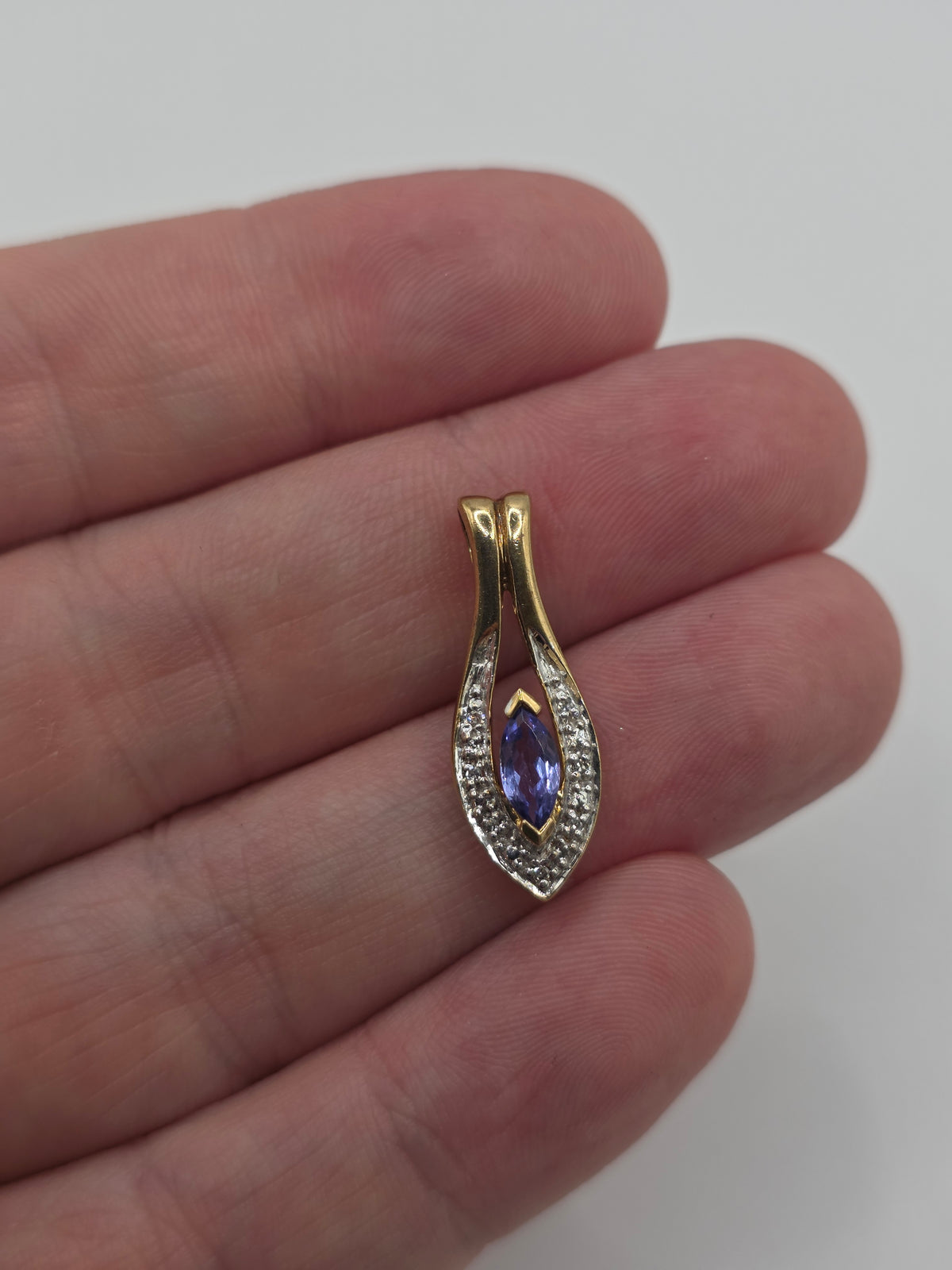 9ct gold tanzanite and diamond pendant