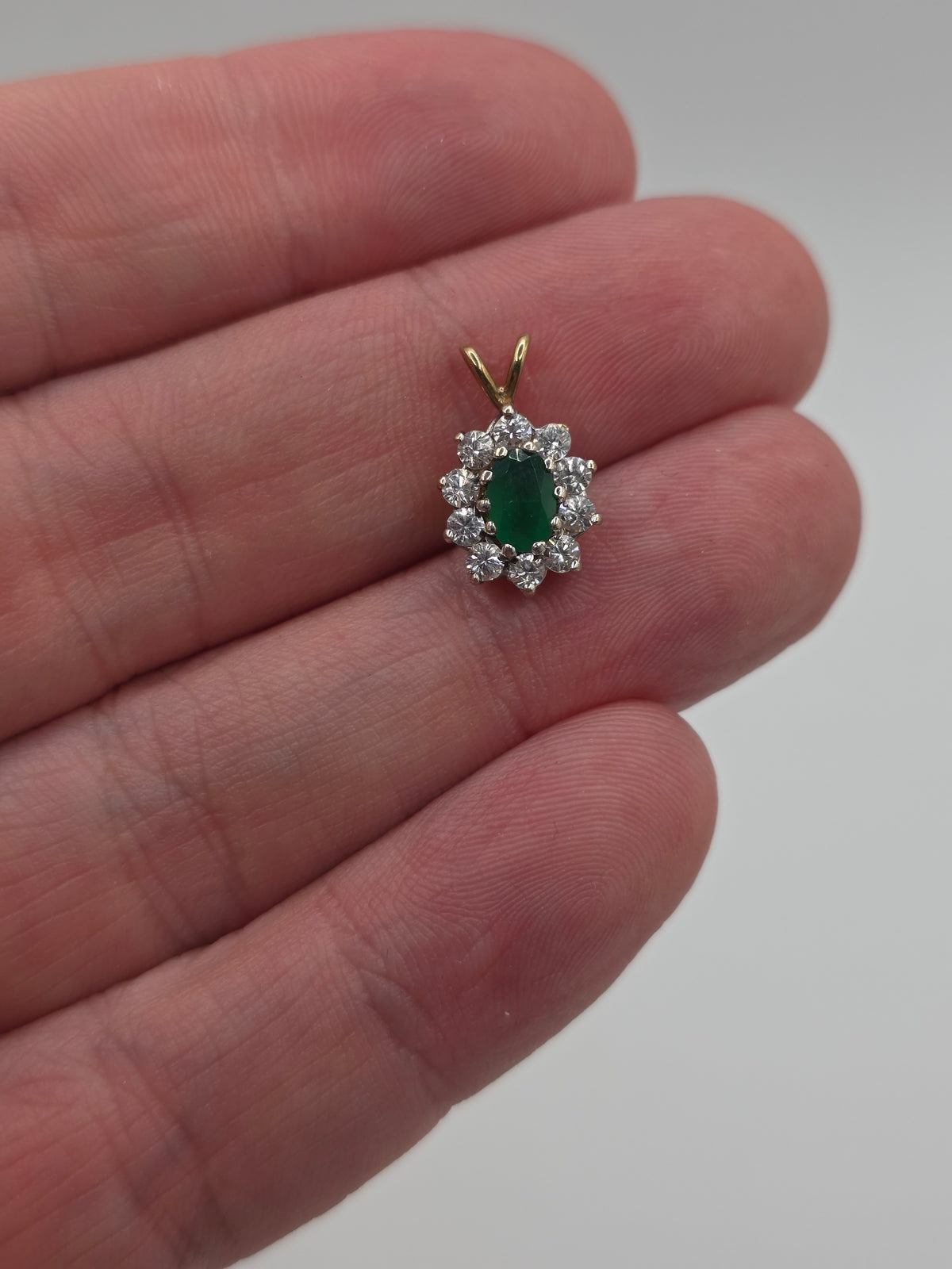 9ct gold emerald and cz pendant