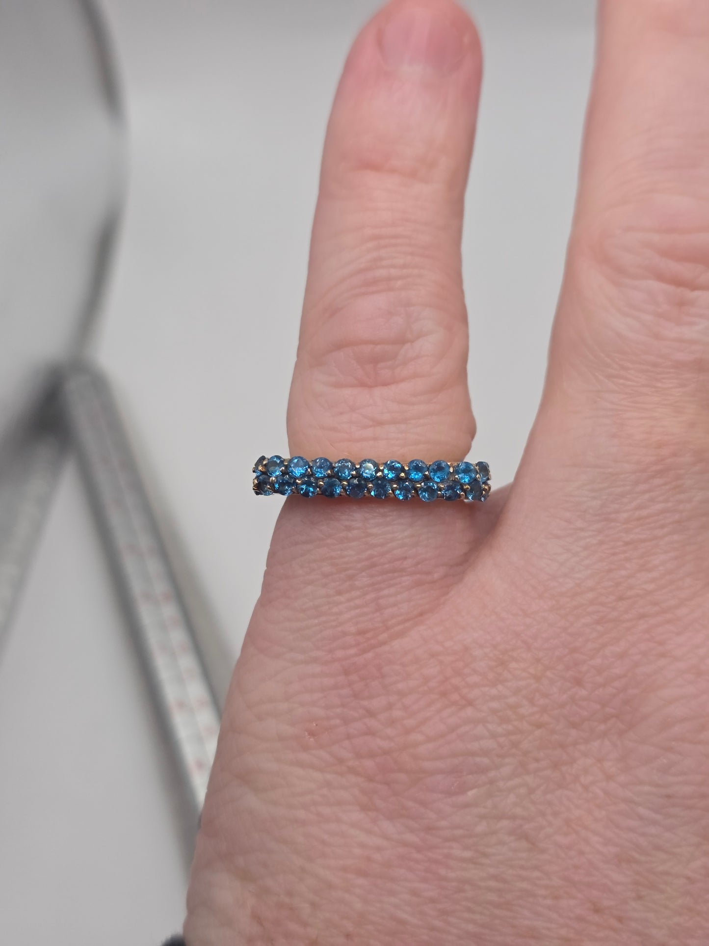 Unusual 9ct gold blue cz ring