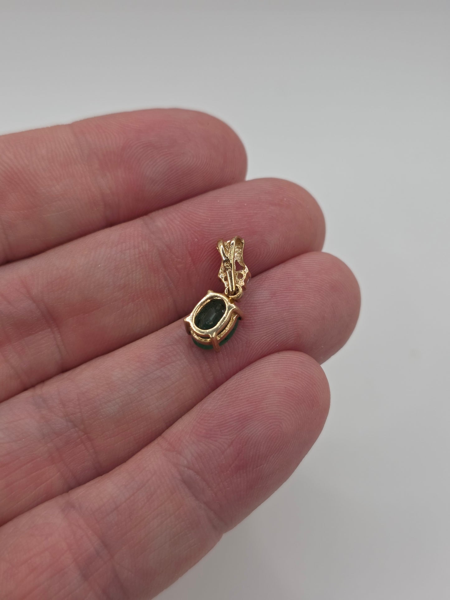 9ct gold emerald and zircon pendant