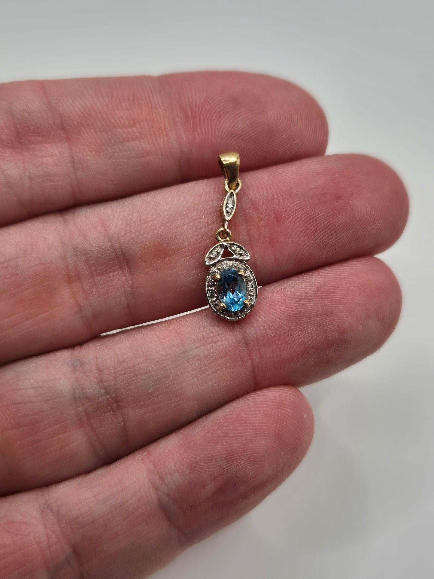 9ct gold topaz and diamond pendant