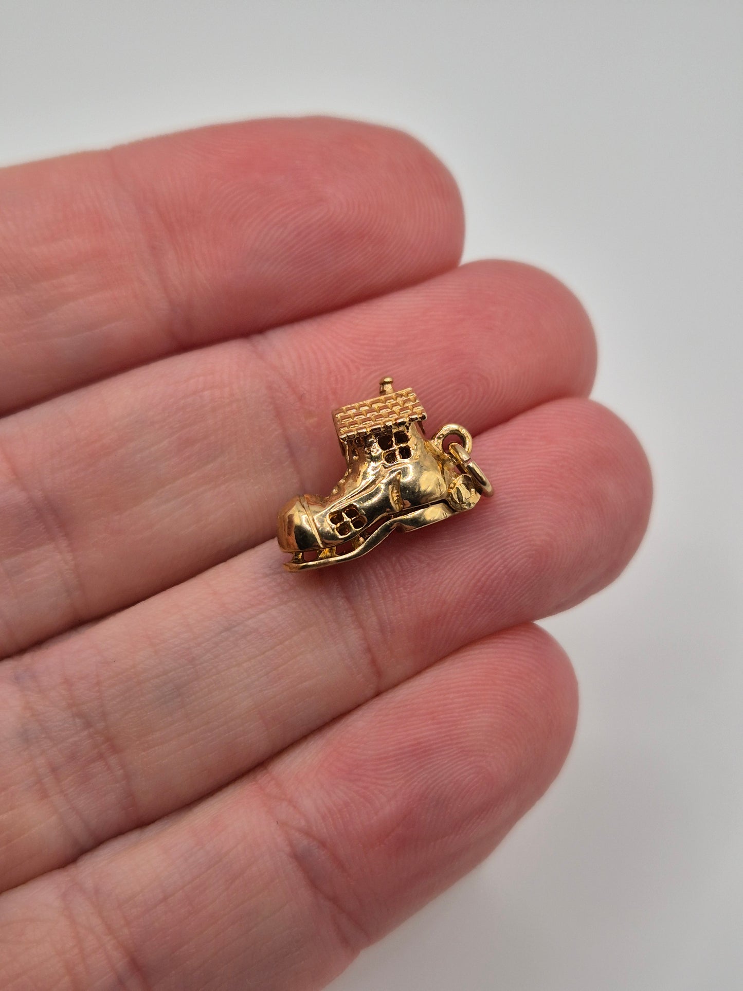 Vintage 9ct gold articulated women in shoe house charm