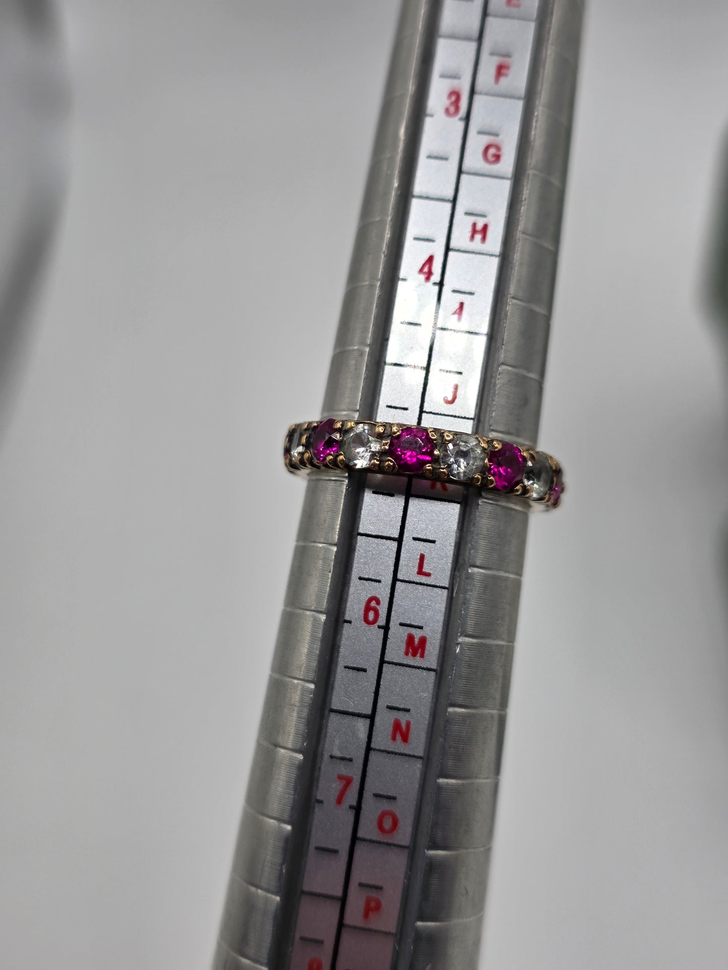 Eternity 9ct gold synthetic ruby and cz ring