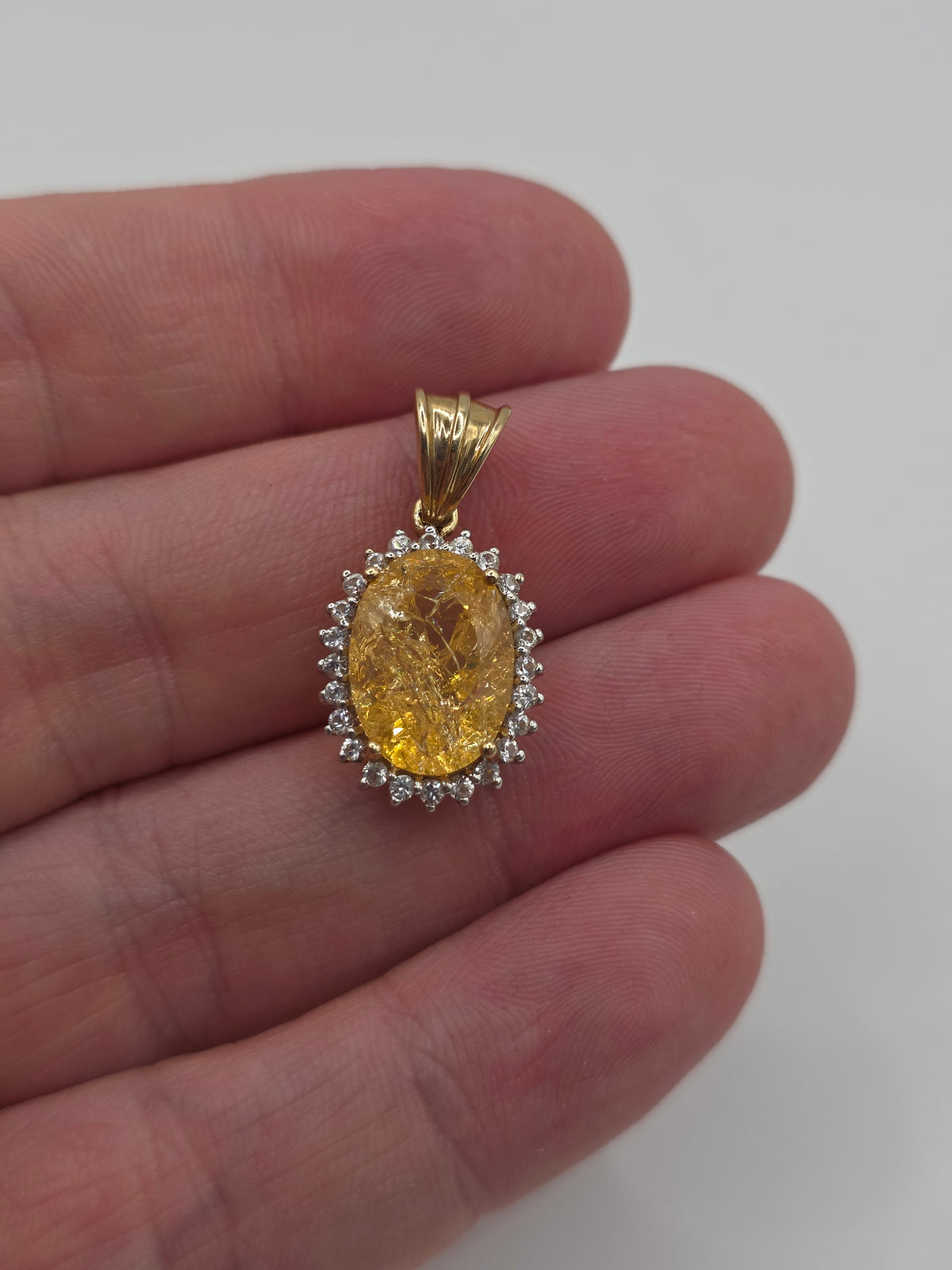 9ct gold rutile quartz and white topaz pendant