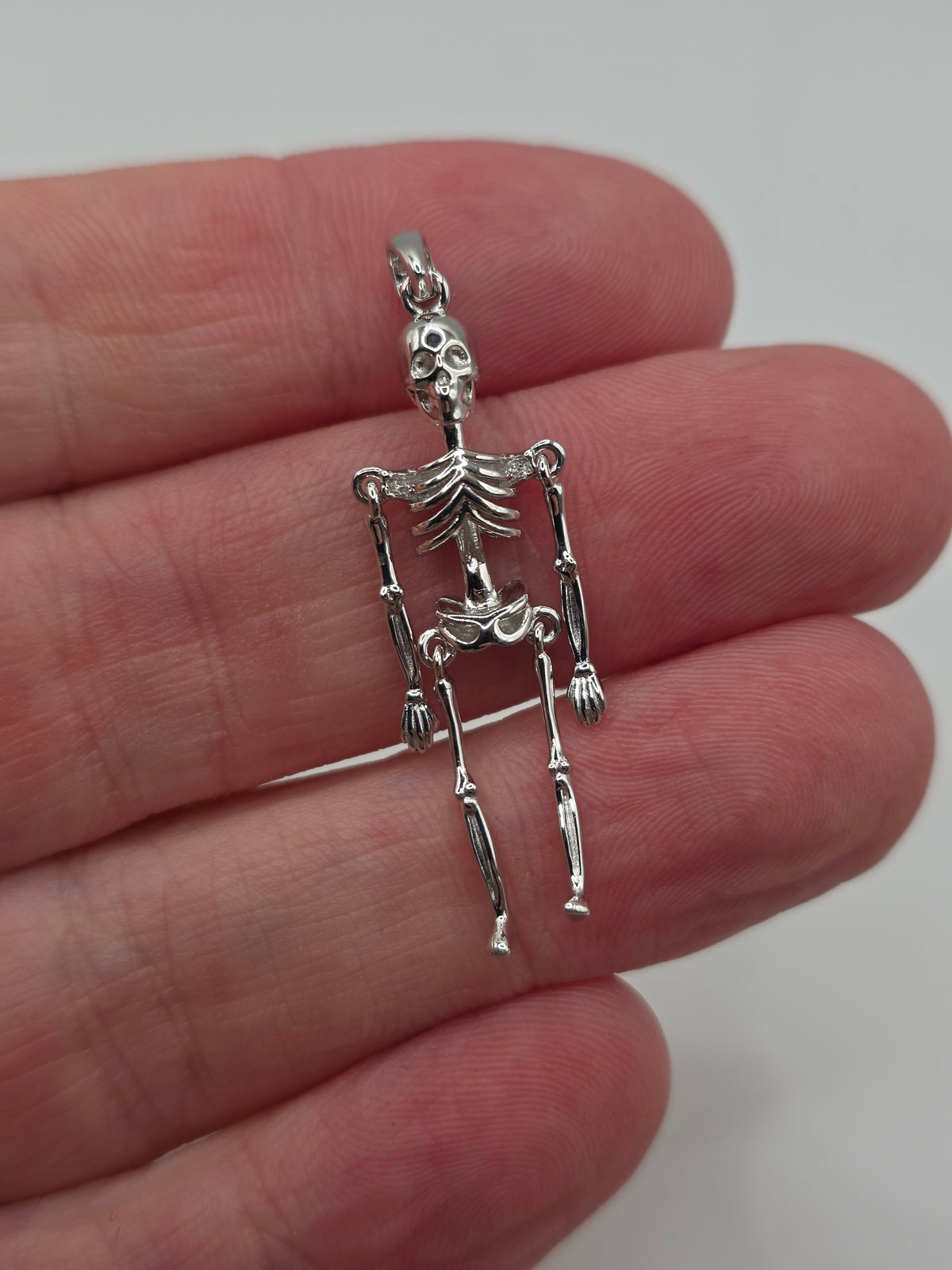 Silver articulated skeleton pendant