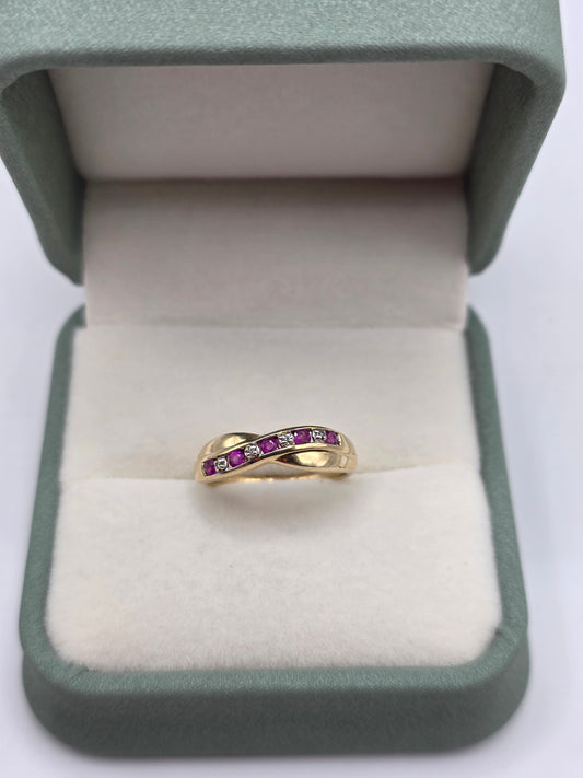 9ct gold ruby and diamond croos over ring