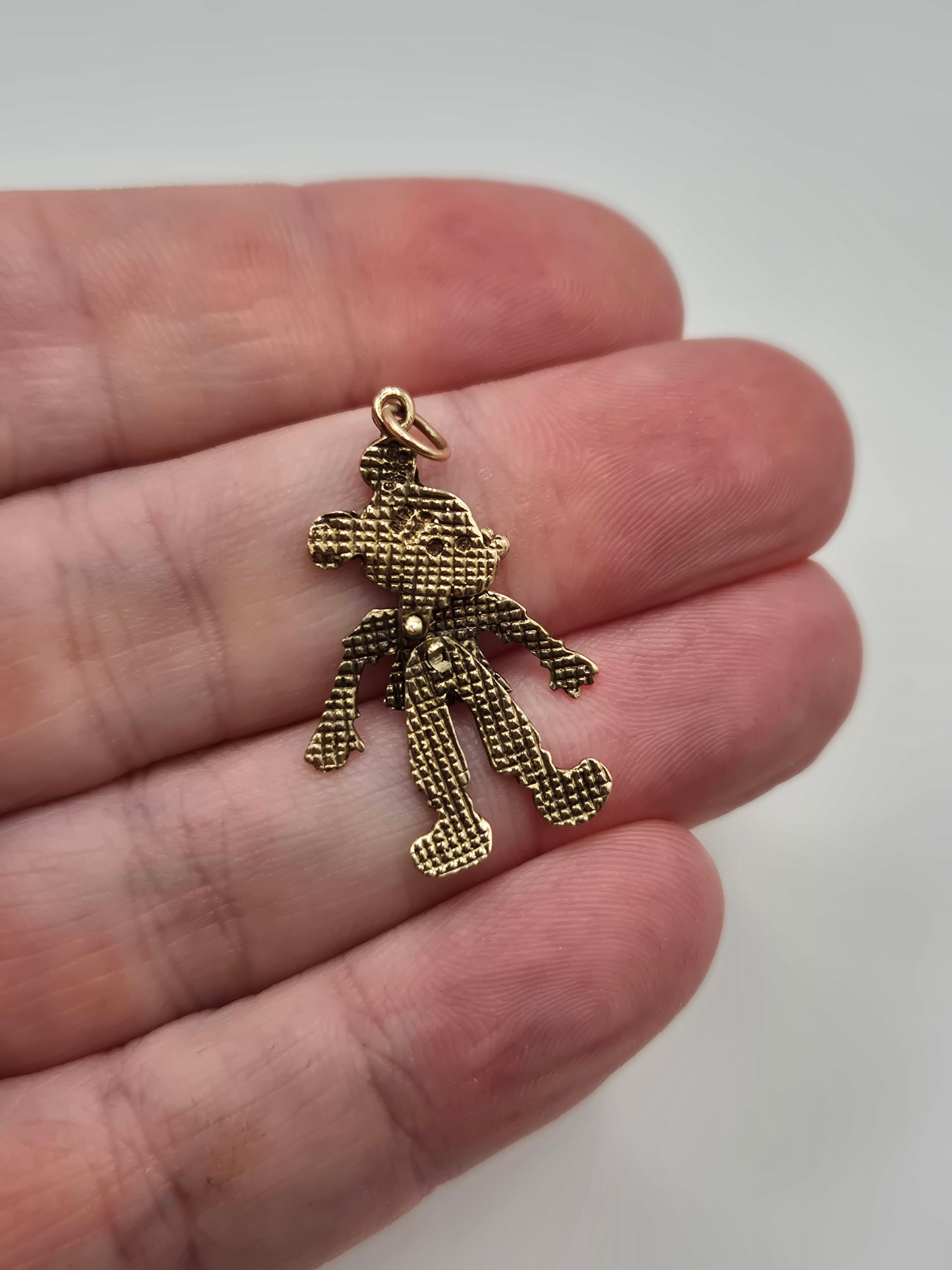 9ct gold articulated character pendant