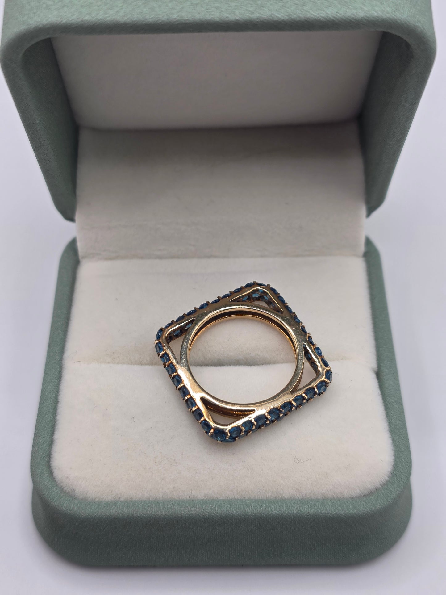 Unusual 9ct gold blue cz ring